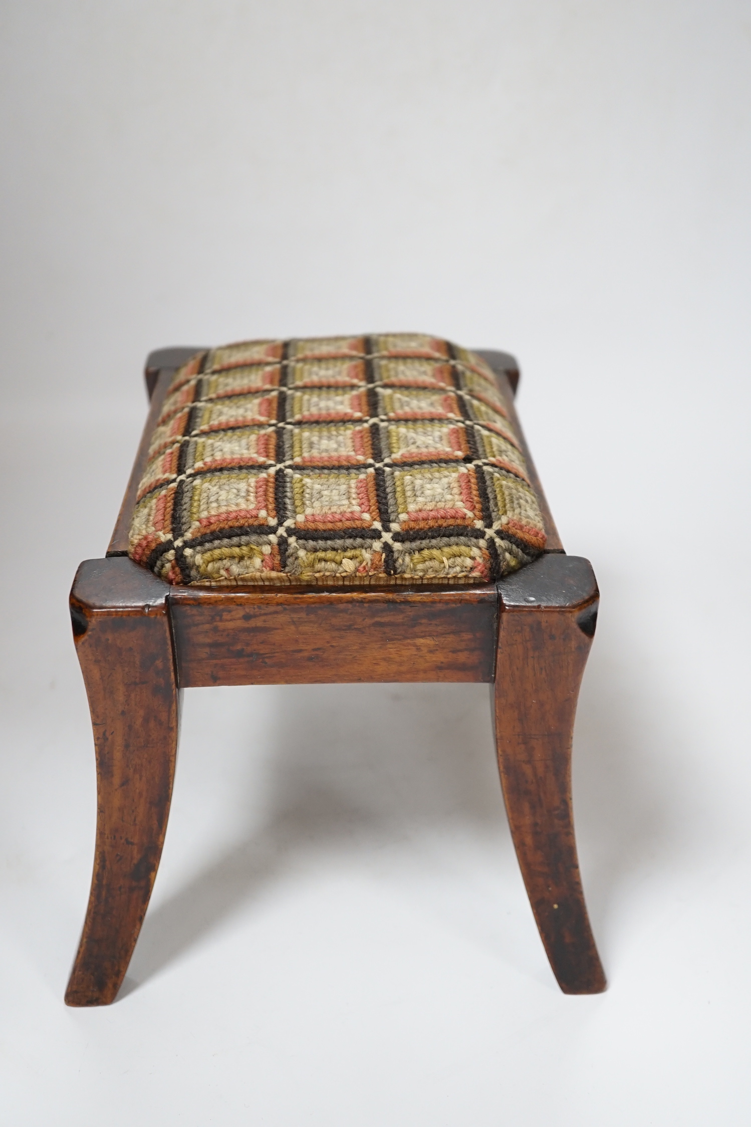 A 19th century walnut lacemaker's stool, 24cm wide
